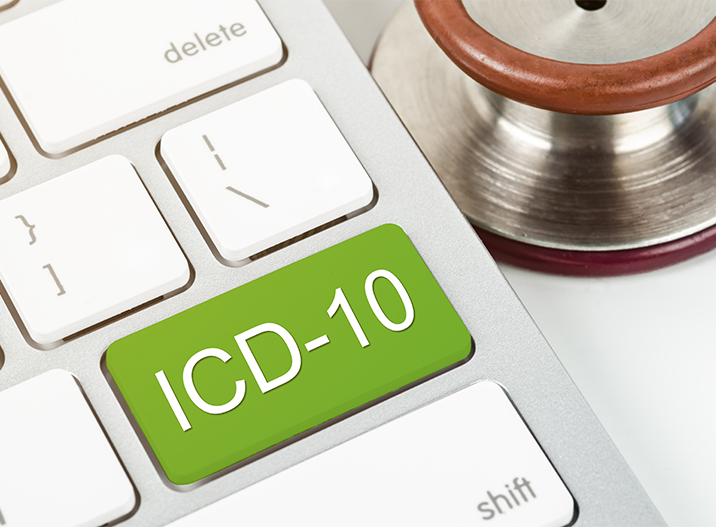 White keyboard with a Green ICD-10 button next to a stethoscope.